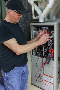 Manasquan NJ furnace repair, Manasquan NJ furnace technician performing repairs